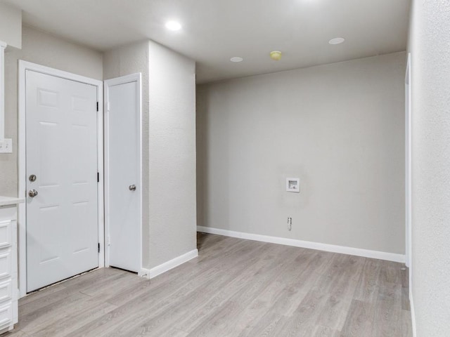 empty room with light hardwood / wood-style floors