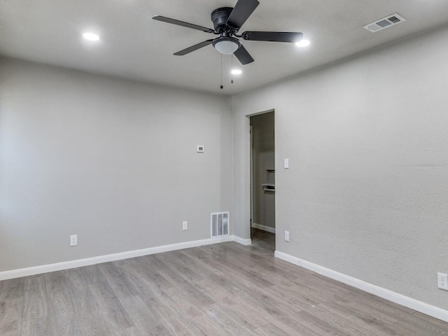 unfurnished room featuring ceiling fan and light hardwood / wood-style flooring