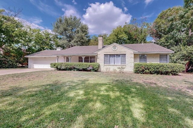 ranch-style house with a front yard and a garage