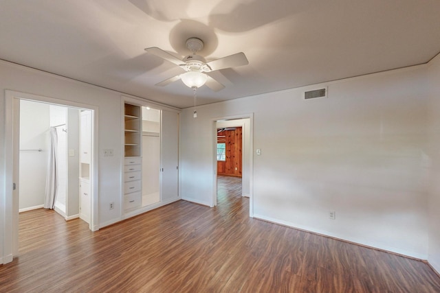 interior space featuring ceiling fan, a closet, and dark hardwood / wood-style floors