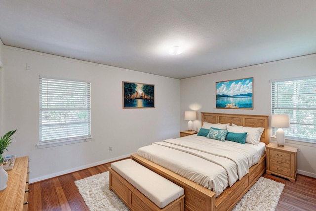 bedroom featuring dark hardwood / wood-style floors