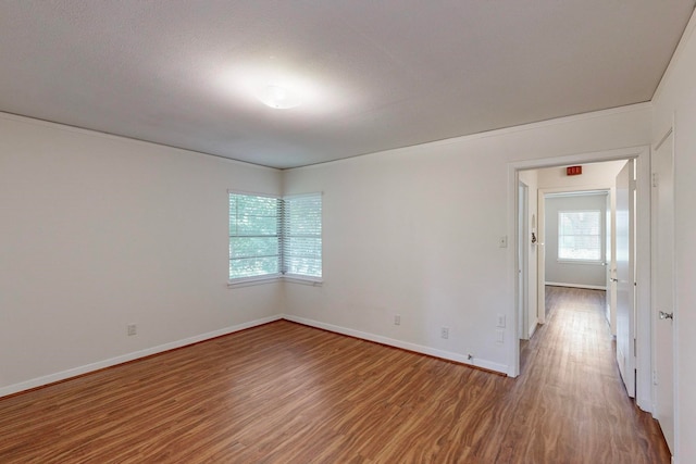 unfurnished room featuring wood-type flooring