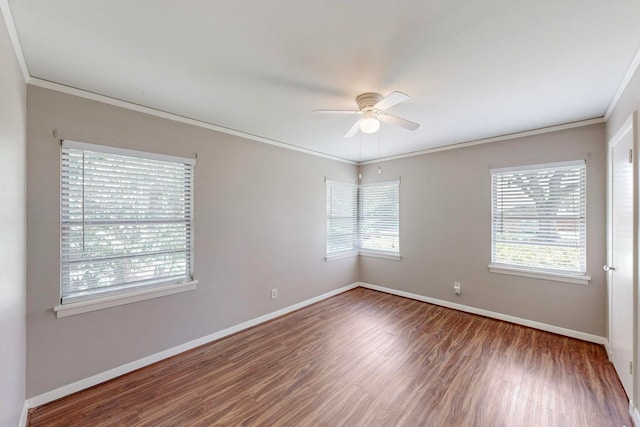 empty room with wood-type flooring, crown molding, and ceiling fan