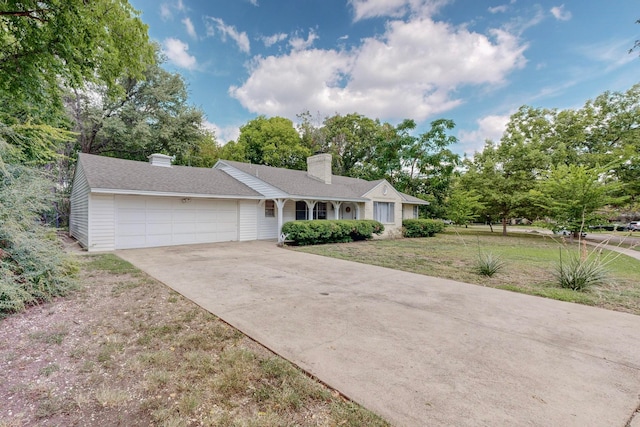 single story home with a front lawn and a garage