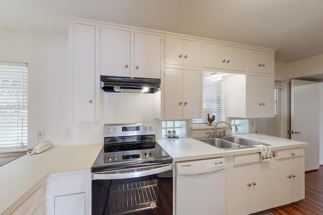 kitchen featuring dishwasher, dark wood-type flooring, sink, white cabinets, and stainless steel electric range