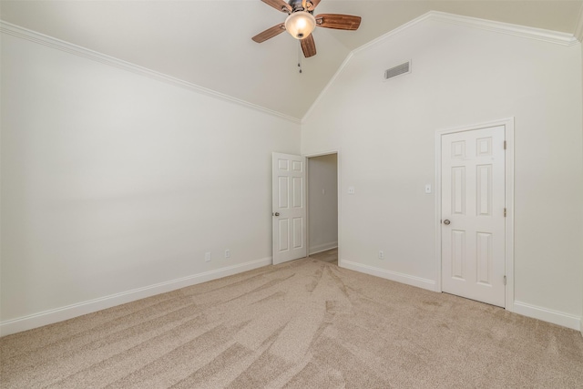 unfurnished room featuring ceiling fan, light colored carpet, ornamental molding, and high vaulted ceiling