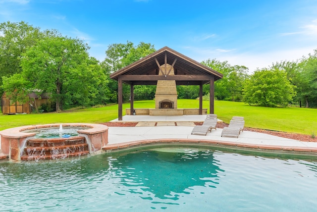 view of swimming pool with a gazebo, a patio area, a yard, and an outdoor fireplace