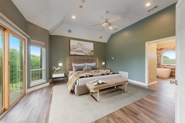 bedroom featuring multiple windows, ceiling fan, vaulted ceiling, and access to exterior