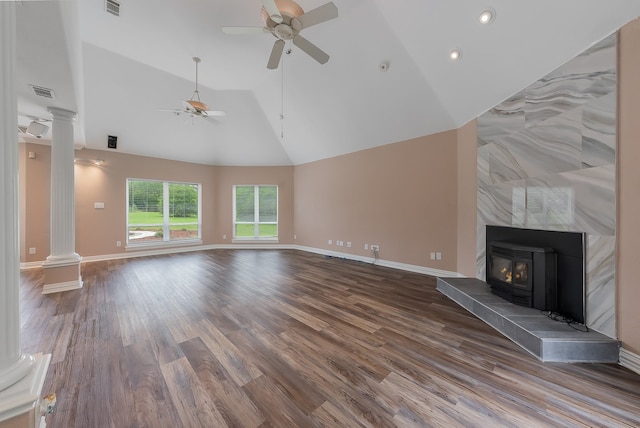 unfurnished living room featuring a tile fireplace, hardwood / wood-style floors, high vaulted ceiling, and ceiling fan