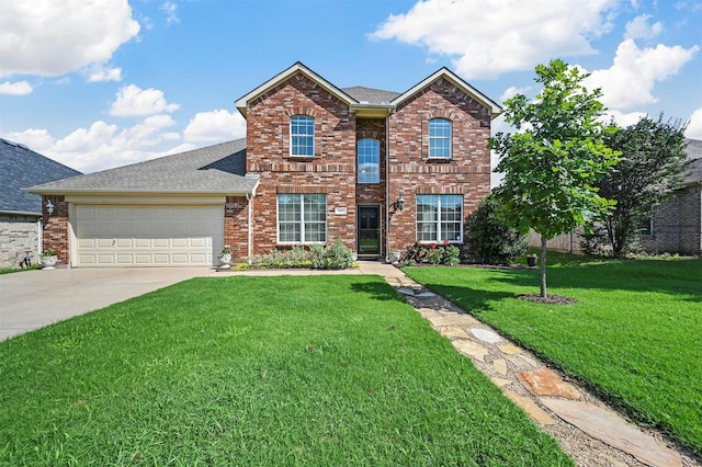 view of property featuring a garage and a front yard