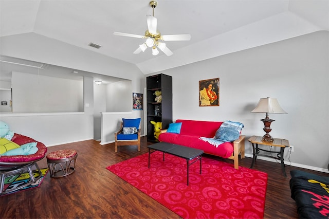 living room with vaulted ceiling, ceiling fan, and dark hardwood / wood-style floors