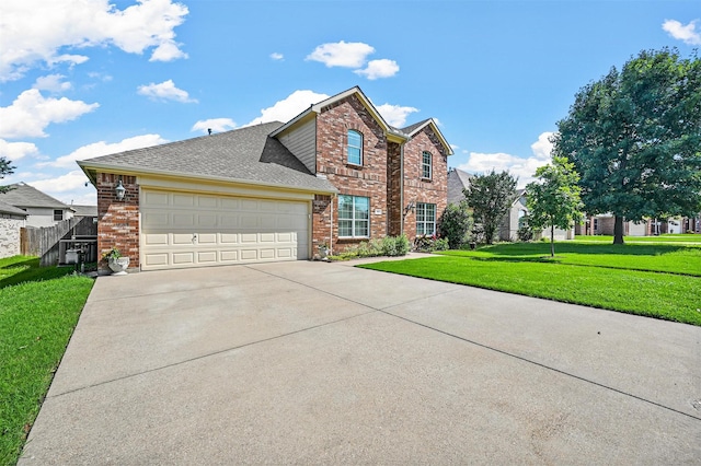 view of front property featuring a front yard and a garage