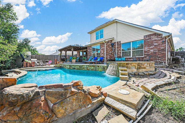 view of swimming pool featuring a gazebo, a patio area, and pool water feature