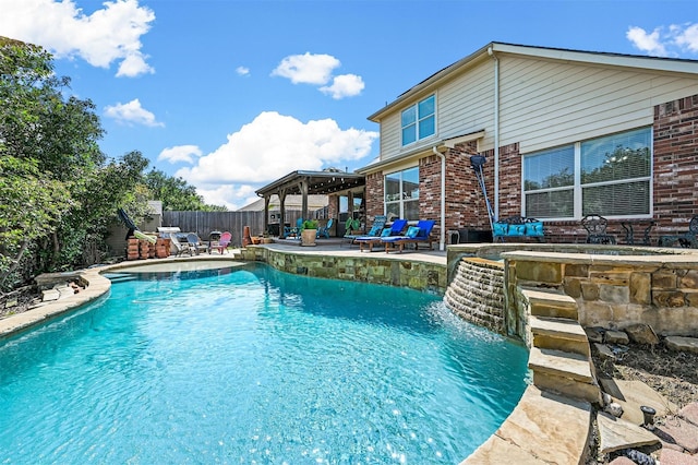 view of swimming pool featuring a gazebo, a patio area, pool water feature, and a hot tub