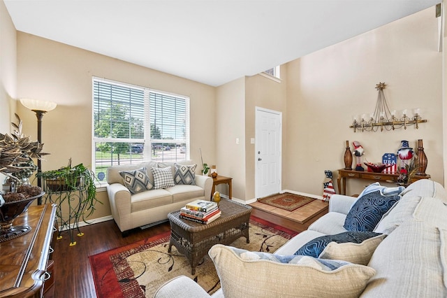 living room with dark hardwood / wood-style flooring