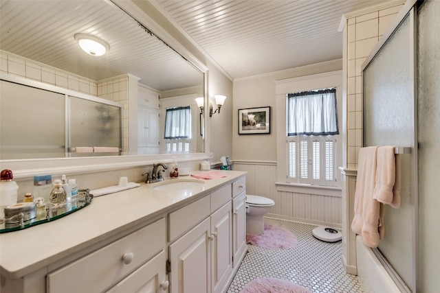 bathroom featuring crown molding, vanity, and toilet