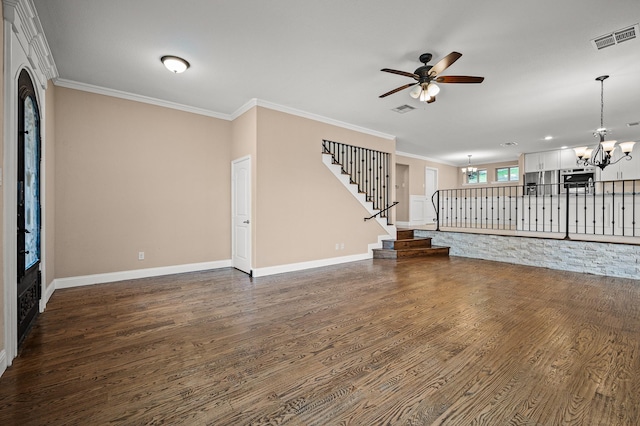 unfurnished living room with crown molding, dark wood-type flooring, and ceiling fan with notable chandelier