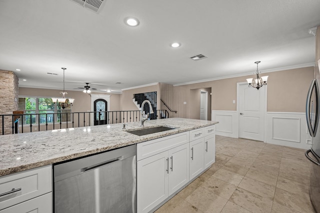 kitchen featuring pendant lighting, dishwasher, white cabinets, ceiling fan with notable chandelier, and sink