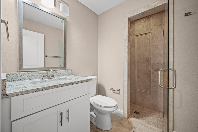 bathroom featuring vanity, toilet, and an enclosed shower