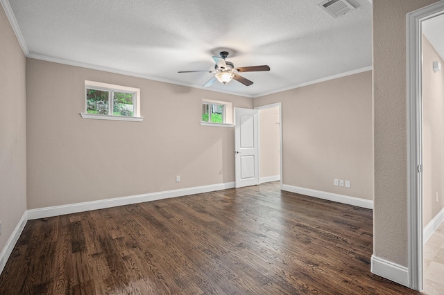 unfurnished room featuring a textured ceiling, dark hardwood / wood-style floors, ceiling fan, and ornamental molding