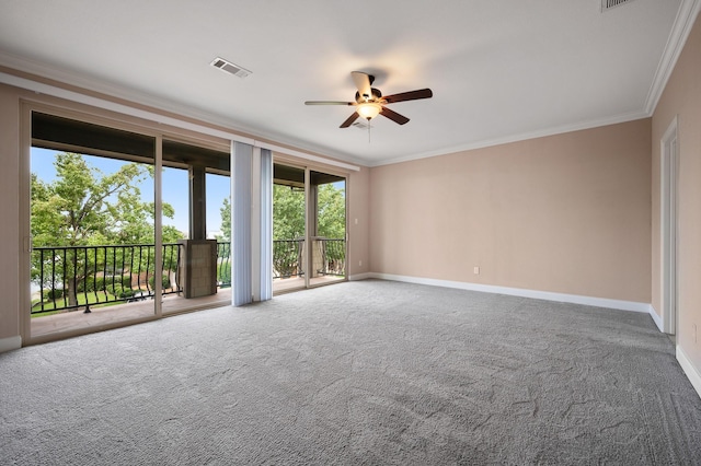 carpeted spare room with ceiling fan and crown molding