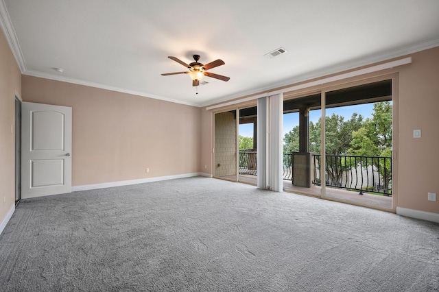 carpeted spare room featuring ceiling fan and ornamental molding