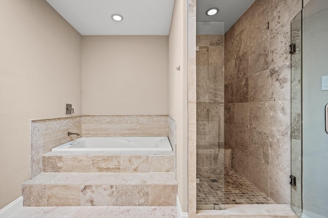 bathroom with shower with separate bathtub