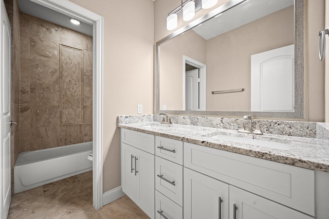 full bathroom with vanity, toilet, and tiled shower / bath