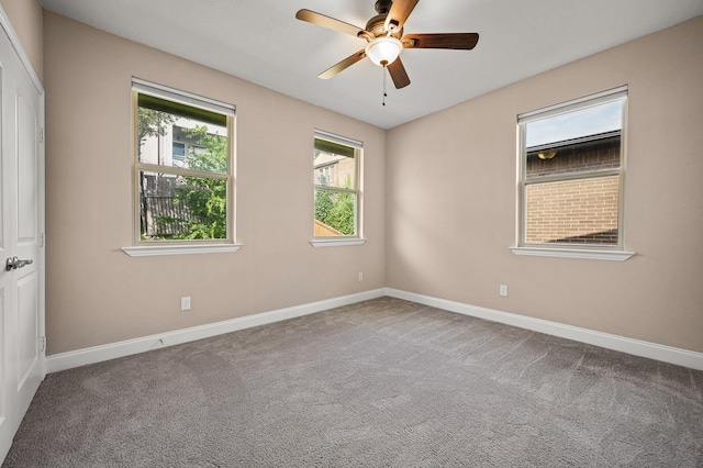 spare room with carpet flooring and ceiling fan