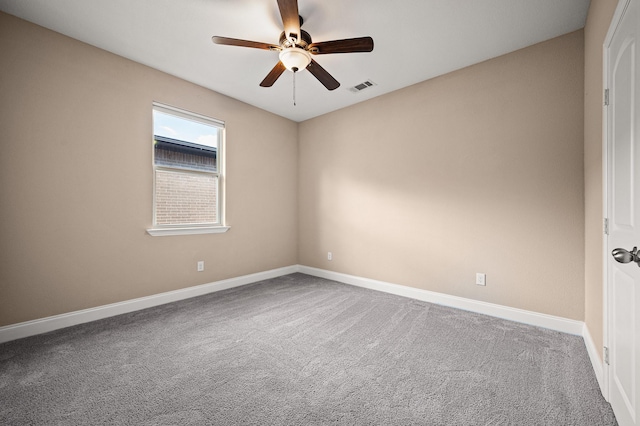 empty room with carpet floors and ceiling fan