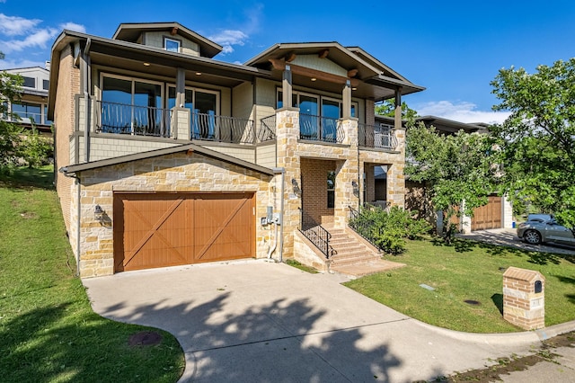 view of front facade with a garage, a balcony, and a front lawn