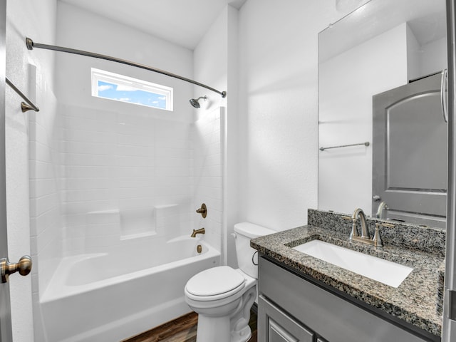 full bathroom featuring shower / washtub combination, hardwood / wood-style flooring, toilet, and vanity