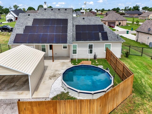 view of pool featuring a patio and a lawn