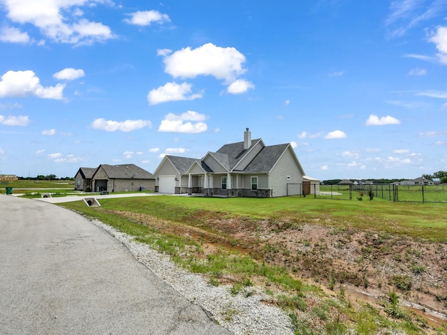 single story home featuring a garage and a front yard