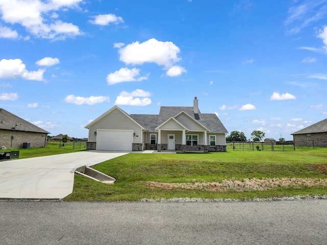 view of front of property with a garage and a front yard