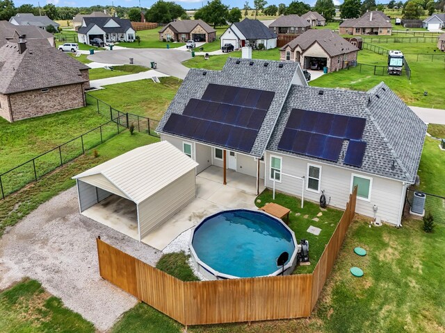 view of swimming pool with a patio area and a lawn