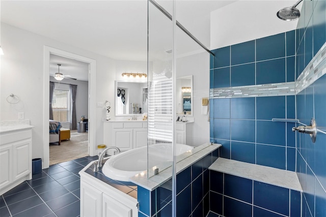 bathroom featuring tile patterned floors, ceiling fan, vanity, and independent shower and bath