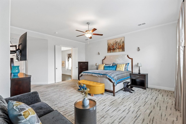 bedroom featuring a ceiling fan, baseboards, crown molding, and visible vents