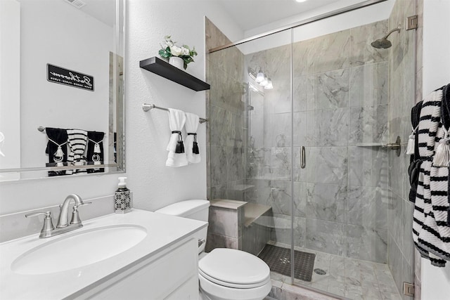 full bath featuring visible vents, toilet, vanity, and a stall shower