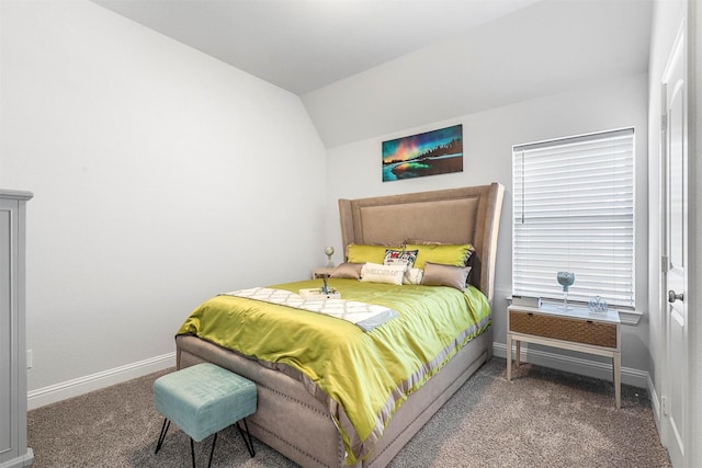 carpeted bedroom featuring vaulted ceiling and baseboards