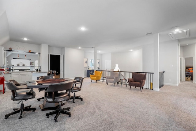 interior space featuring attic access, visible vents, recessed lighting, light colored carpet, and lofted ceiling