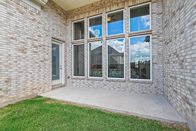 doorway to property featuring brick siding