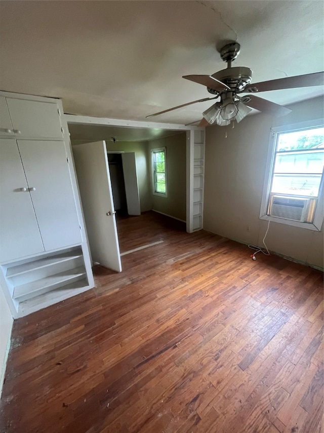 unfurnished bedroom featuring dark hardwood / wood-style flooring and ceiling fan