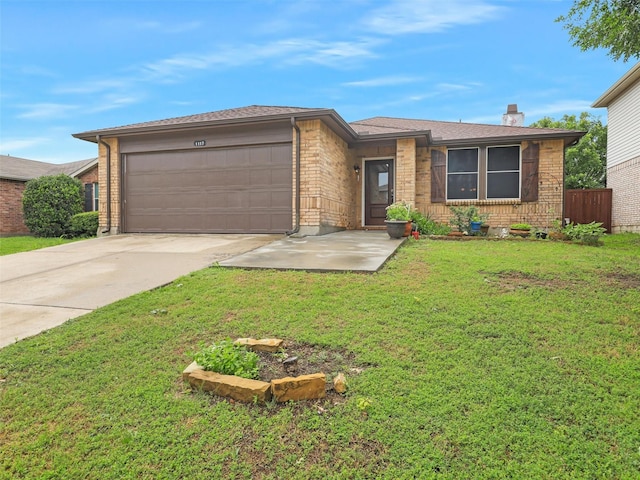 single story home with a front yard and a garage