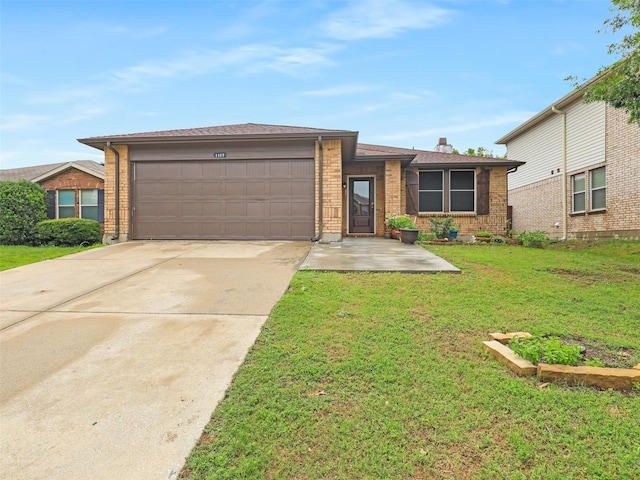 ranch-style home with a front yard and a garage