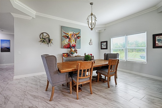 dining area with crown molding and an inviting chandelier