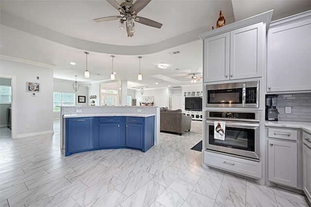 kitchen with blue cabinets, hanging light fixtures, ornamental molding, tasteful backsplash, and stainless steel appliances