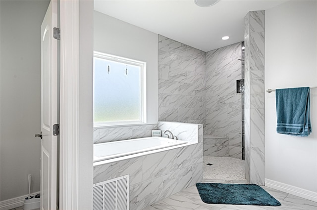 bathroom featuring separate shower and tub