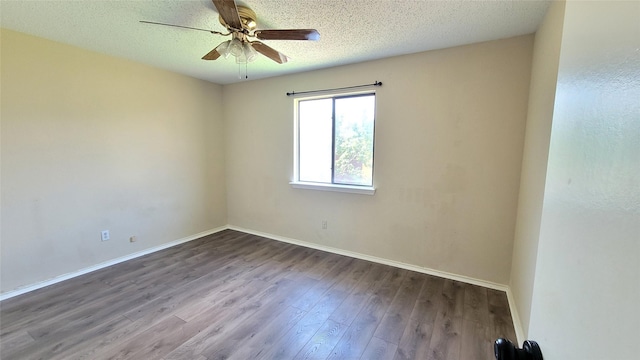 unfurnished room featuring ceiling fan, wood-type flooring, and a textured ceiling