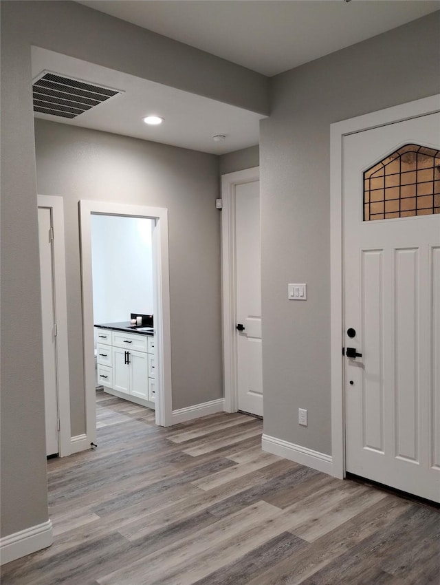 foyer entrance featuring light hardwood / wood-style floors